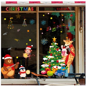 Detailed Christmas window decals featuring cartoon animals and musical party motifs on glass