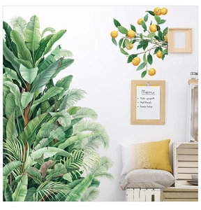 Détail de stickers muraux feuilles de bananier et citron dans un décor nordique lumineux