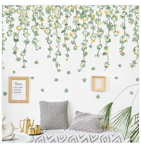 Hanging vine wall stickers with green clover and white daisies for home wall decor