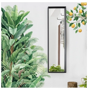 Détail de stickers muraux feuilles de bananier tropicales et branche d'oranger