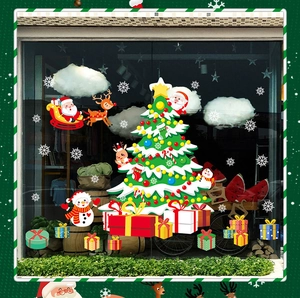 Detailed Christmas tree and Santa Claus decals displayed on a glass shop window