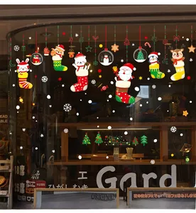 Christmas window stickers with Santa, reindeer and snowflakes on cafe glass display