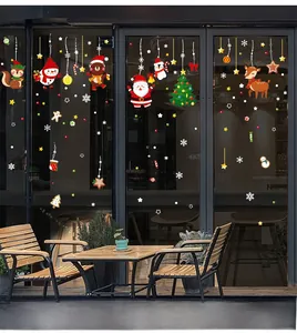 Christmas window stickers set featuring Santa, snowmen and reindeer on a glass shop window