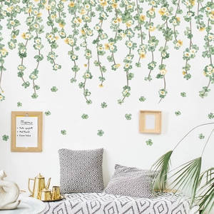 Nordic wall sticker featuring hanging white daisies and green clover vines for home decor