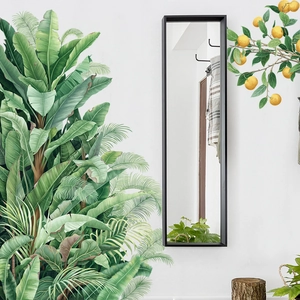 Miroir sur pied minimaliste avec cadre en métal noir et stickers muraux de plantes vertes