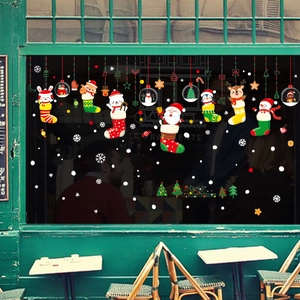 Christmas window decals set featuring Santa and reindeer on shop glass for festive decoration