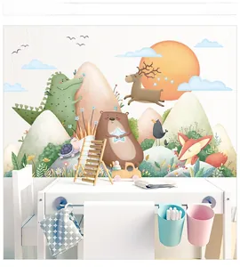 Detail of mountain forest wall decals with cartoon deer and fox in kids playroom