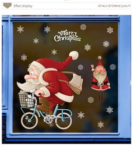 Detail of Santa Claus on bicycle static window decal with white snowflakes and Merry Christmas text