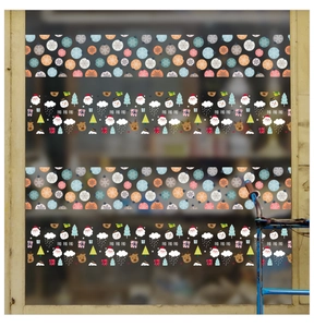 Detailed view of Christmas window stickers featuring Santa, snowmen, and reindeer designs