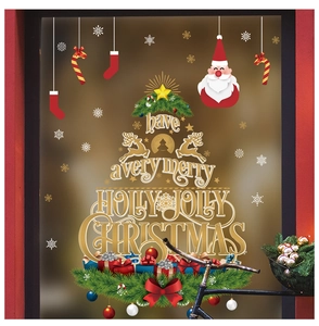 Macro detail of Merry Christmas tree window stickers with Santa and snowflake motifs