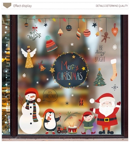 Detail showing colorful Christmas snowman and Santa static window stickers for festive glass decor