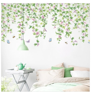 Detail view of purple morning glory and ivy vine wall stickers in a cozy bedroom setting