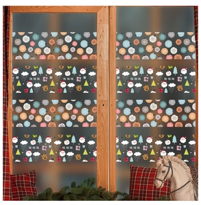 Detail of Christmas window stickers with Santa and snowman on a glass pane in cozy home