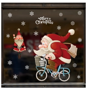 Detail of Santa Claus on bicycle and snowflake window stickers for Christmas decor