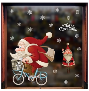 Detail of Christmas window stickers featuring Santa on a bicycle with snowflakes
