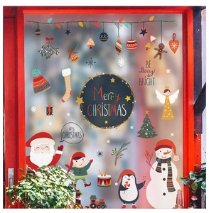 Detail of Christmas window stickers featuring snowman and Santa for holiday glass decor