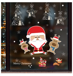 Detail of cartoon Santa Claus and reindeer window stickers with Merry Christmas text
