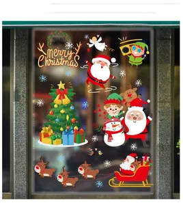 Macro detail of Christmas static stickers with Santa and reindeer on glass window