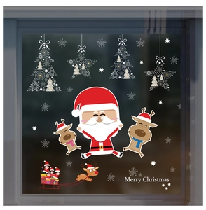 Detail of cartoon Santa Claus and reindeer window stickers for festive shop decoration