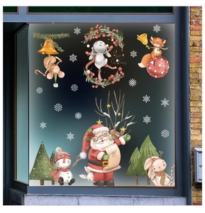 Christmas window decals with Santa, snowman, and bunny applied on a glass surface