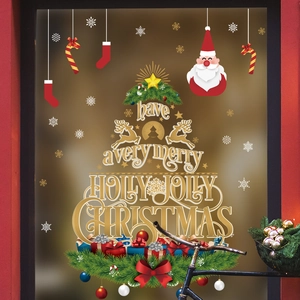 Christmas tree window decals with festive lettering and golden snowflakes for shop decor
