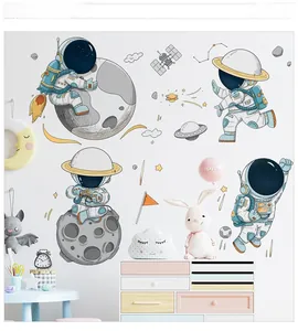Detail showing cartoon astronaut wall decals with planets and stars in a child bedroom