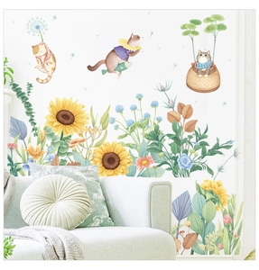 Detail of sunflower and cartoon cat wall stickers displayed on a living room wall