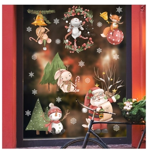 Close-up of Christmas window stickers with festive rabbits, foxes, and Santa Claus