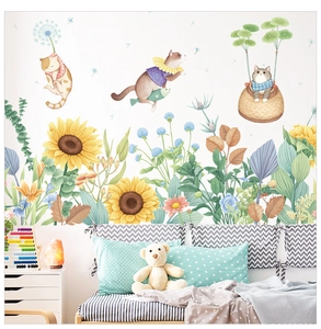 Detail view of watercolor cat stickers with sunflowers and dandelions in kids bedroom decor