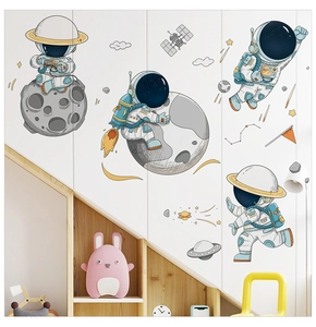 Detail of cute astronaut wall stickers with planets and stars for kids room decor