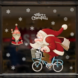 Christmas window stickers with cartoon Santa on a bike and snowflakes for 2025 holiday decor
