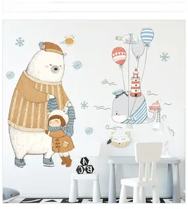 Detail of hand-drawn cartoon bear, girl, and whale wall stickers for kids room decor