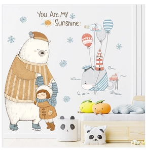 Detail of big bear and whale balloon wall stickers in a cozy minimalist nursery