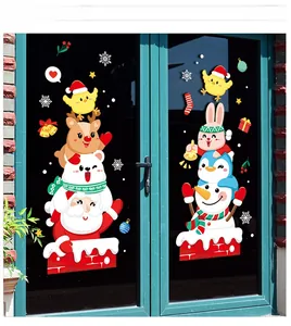 Detail of Santa and Snowman static window decals applied on a glass door for Christmas