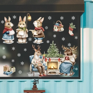 Christmas window stickers featuring watercolor rabbits, reindeer, and a festive fireplace
