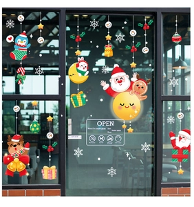 Static Christmas window stickers with Santa, penguin and snowflakes on a glass door