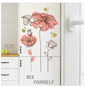 Detail of pink flowers and bees wall decals with Bee Yourself quote on a white cabinet