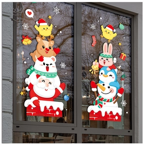 Detail view of festive Santa and snowman static window decals on a clear glass window