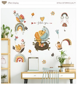Detailed close-up of cartoon bird and rainbow wall stickers in Morandi color tones
