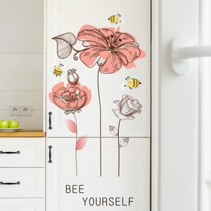 Pink floral wall decals with cartoon bees and Bee Yourself text on white cabinet
