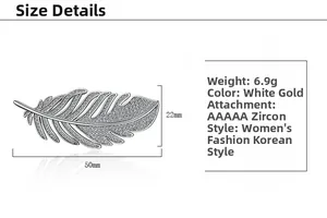 Detailed view of zircon feather brooch with size specs 50mm by 22mm and 6.9g weight