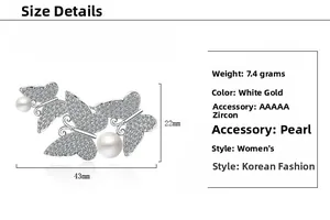 Detail view of pearl butterfly brooch with zircon inlays and dimensions 43mm x 22mm