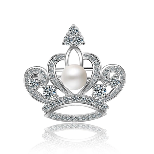 Elegant zircon crown brooch with silver finish and white pearl inlay on white background