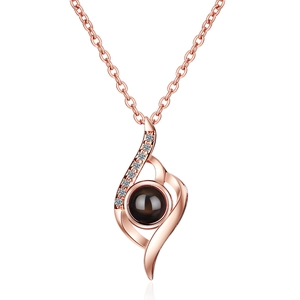 Rose gold projection necklace with flame design and I Love You in 100 languages
