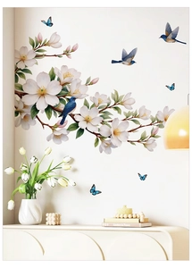Close-up of elegant magnolia wall stickers with blue birds and butterflies on the wall