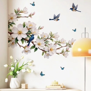 Elegant wall decals featuring white flowers, blue birds and butterflies for home decoration
