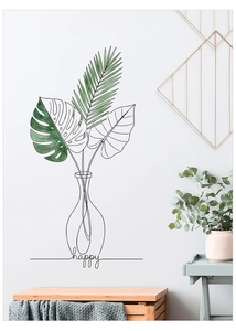 Detail of minimalist wall sticker featuring monstera leaf lines and happy text