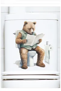 Detail view of a funny brown bear reading newspaper waterproof toilet seat wall decal