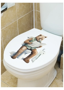 Waterproof PVC sticker showing a cute bear reading a newspaper on a white toilet lid