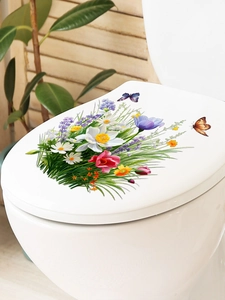 Floral toilet lid decals featuring colorful butterflies and flowers on white ceramic
